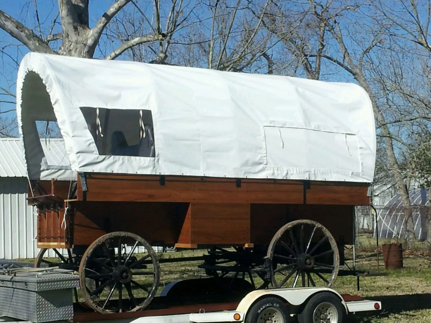 Side profile of a white covered prairie wagon