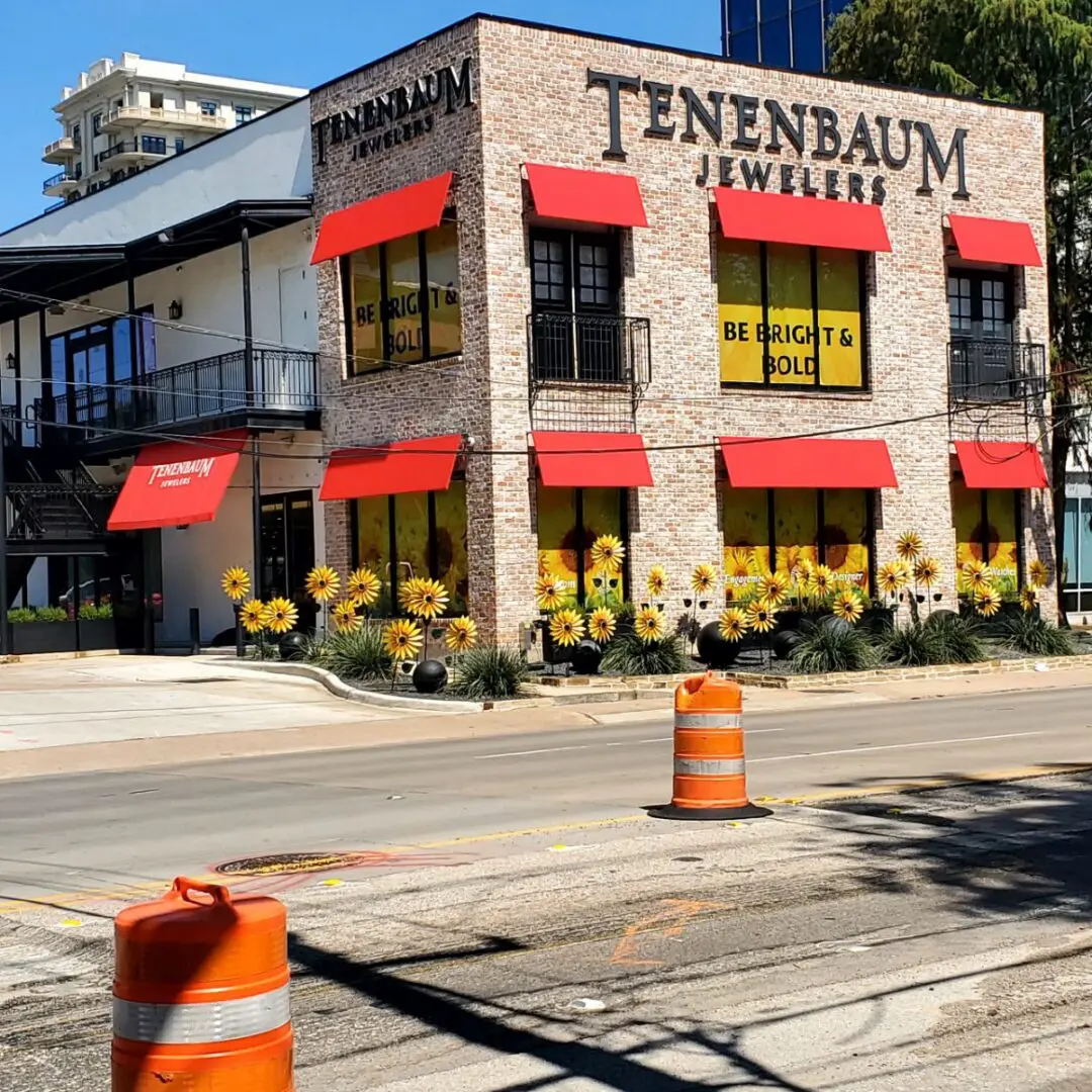 Tenenbaum Jewelers storefront with red awnings and fall decorations.